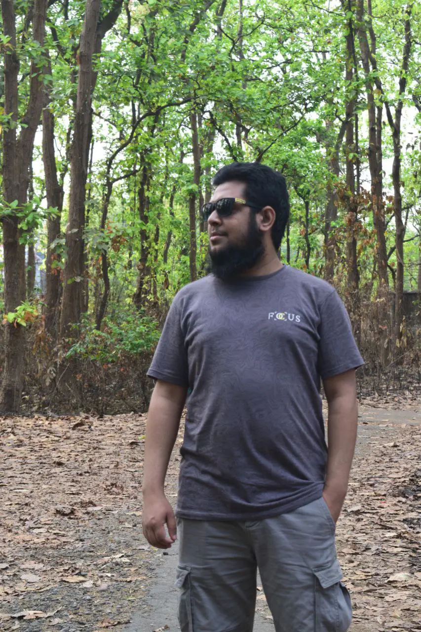 Galib outdoors on a wooded trail